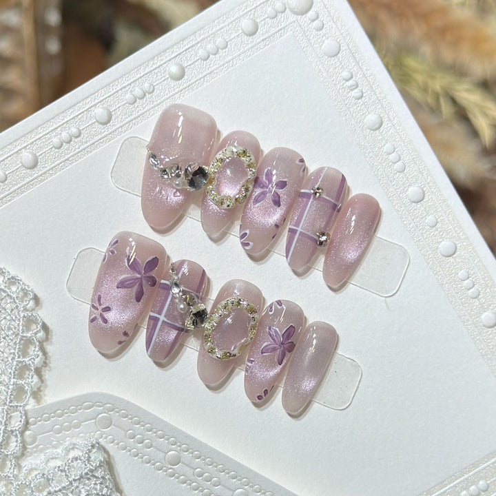 Artistic Press-On Nail Set with Floral Accents Bowlift