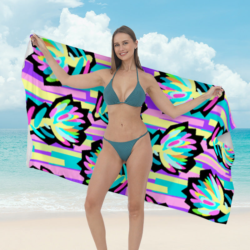 Beach towel with vibrant tropical plant motif Bowlift