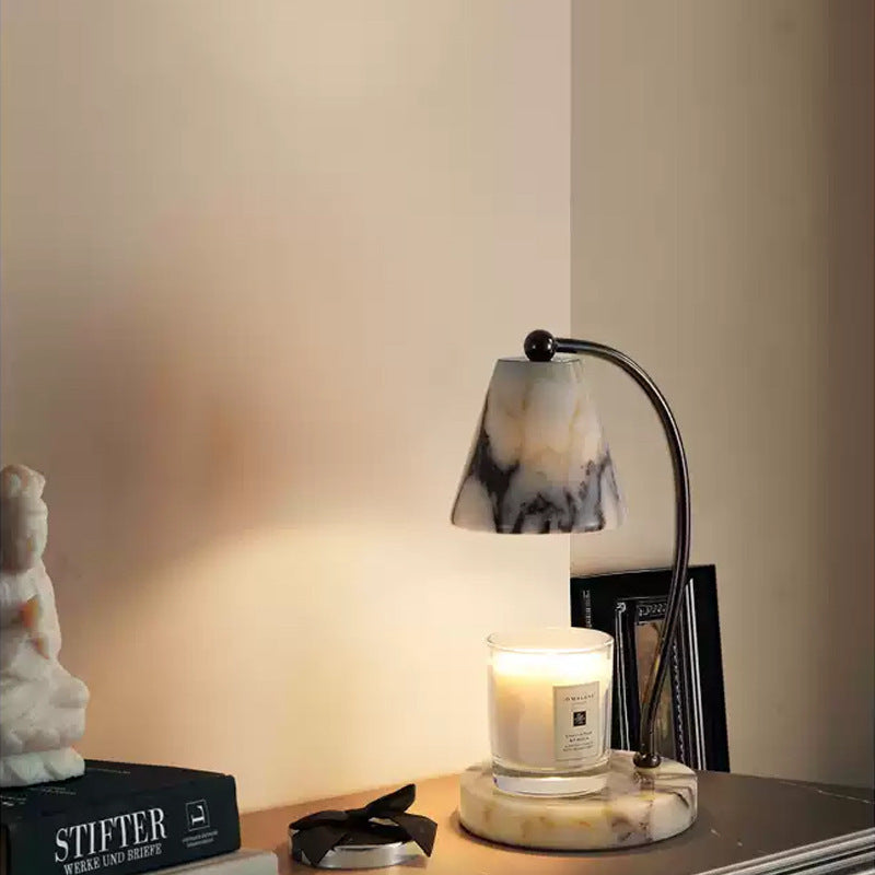 Marble bedside lamp with integrated candle tray and curved metal arm Bowlift