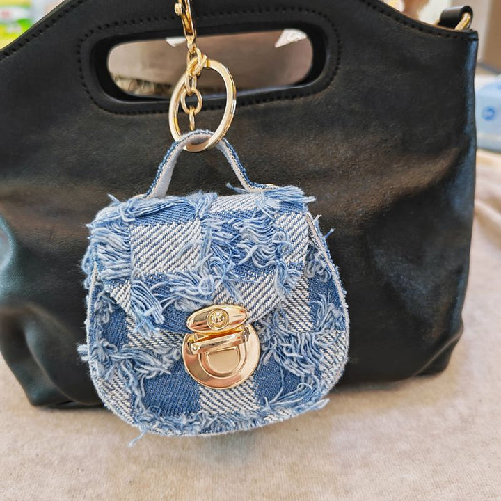 Distressed denim micro crossbody mini purse with gold turn-lock top handle Bowlift