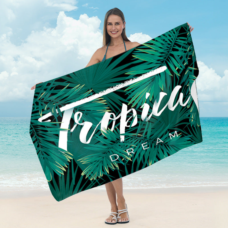 Beach blanket with tropical leaf design Bowlift