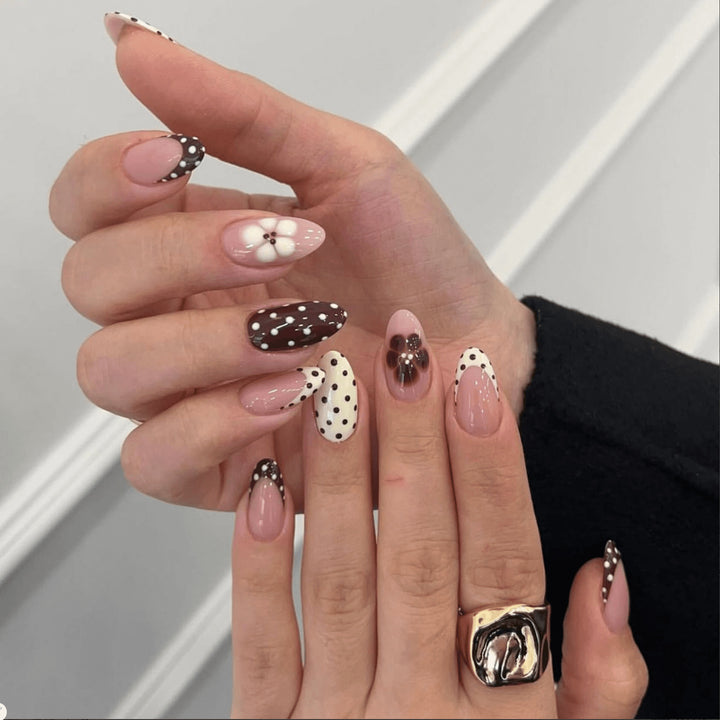 Artful nail art with floral design and various patterns Bowlift