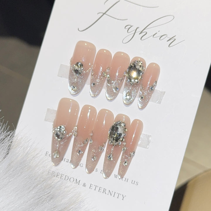 Glamorous artificial nail tips with rhinestone accents Bowlift