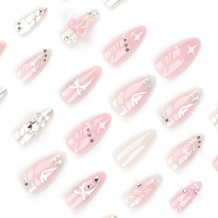 Artful stiletto nails in an elegant design with creative embellishments Bowlift