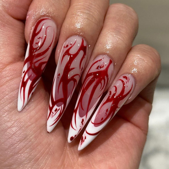 Creative Stiletto Nail Art with Blood Red Accents Bowlift