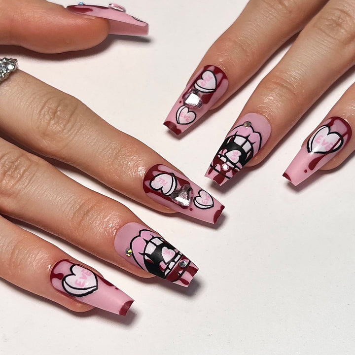 Artful stiletto nails with hearts and glitter accents Bowlift