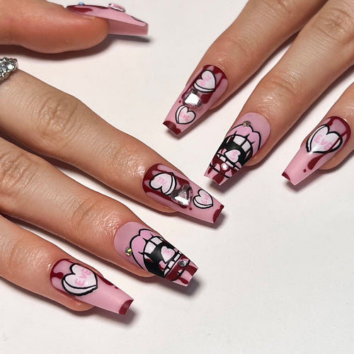 Artful stiletto nails with hearts and glitter accents Bowlift
