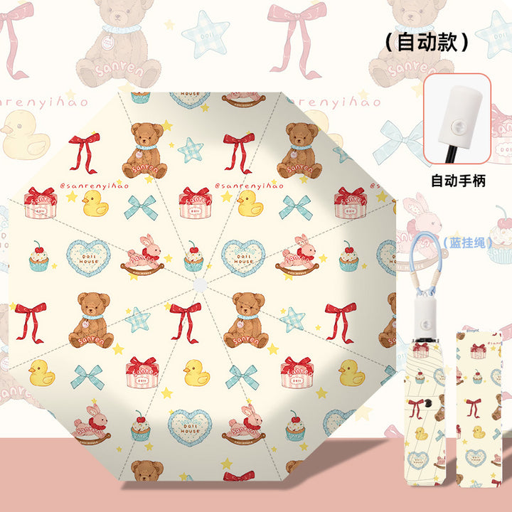 Women's folding umbrella with automatic opening mechanism and playfully themed design Bowlift