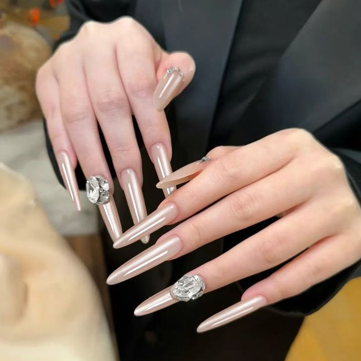 Acrylic nail set with elegant tips and glamorous rhinestone accents Bowlift