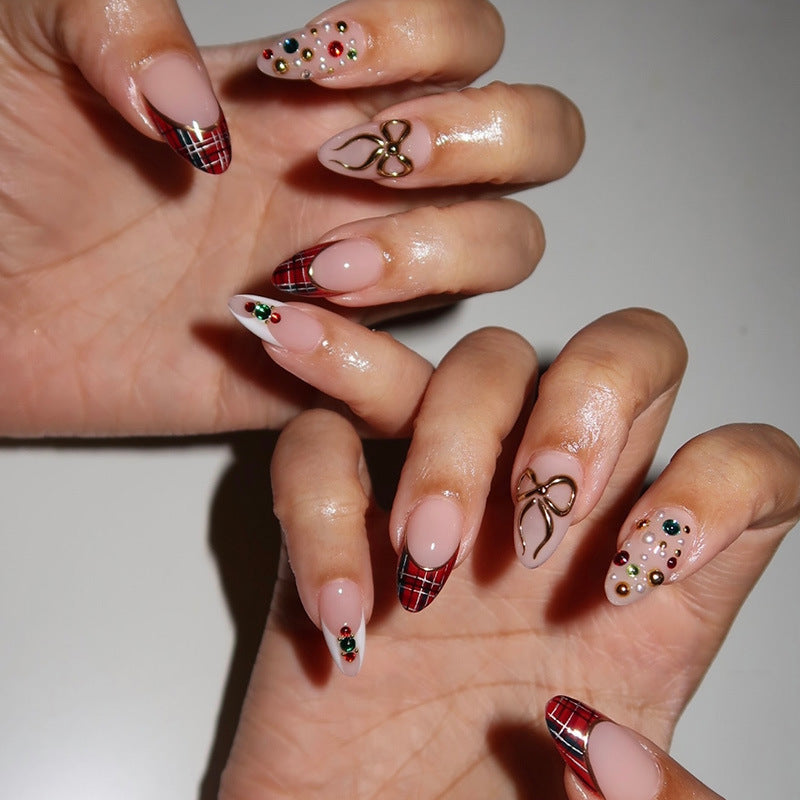 Artificial nail set with festive design and sparkling accents Bowlift