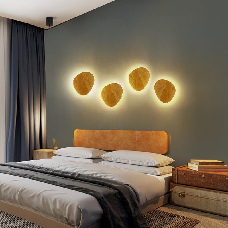 Organic pebble-shaped LED wall sconce solid wood face warm ambient backlight Bowlift
