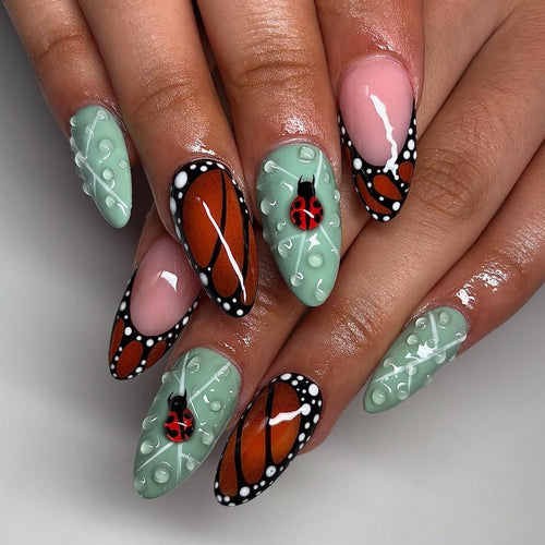 Creative nail art with elaborate butterfly and flower designs Bowlift