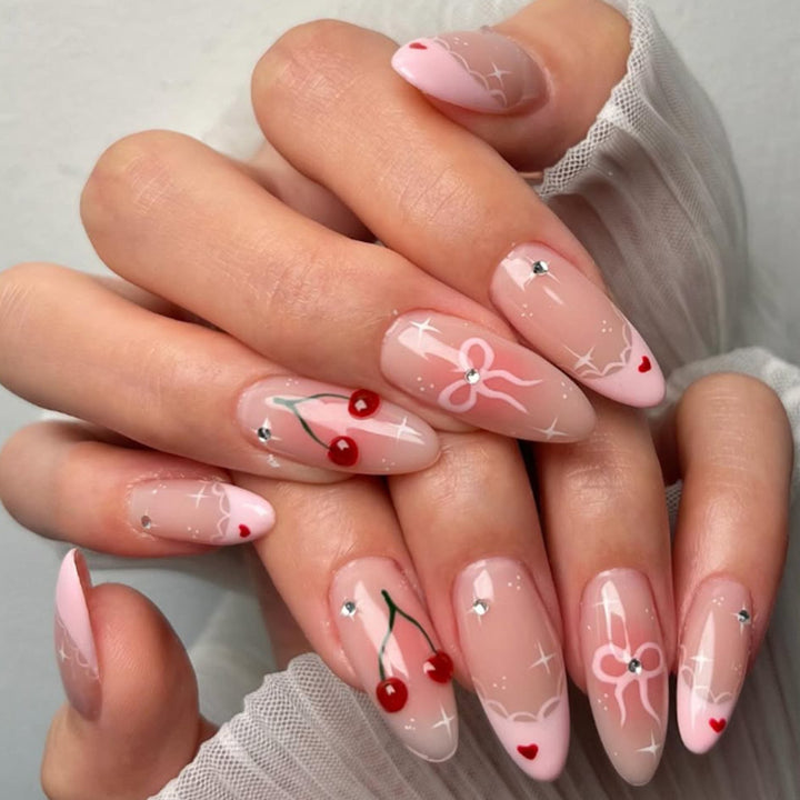 Artifical nails with playful heart and bow designs Bowlift