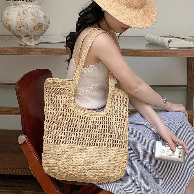 Hand-knotted raffia bag with generous interior Bowlift