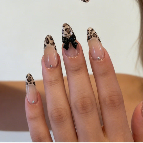 Artistic Press-On Nail Set with Leopard Print and Bow Accents Bowlift