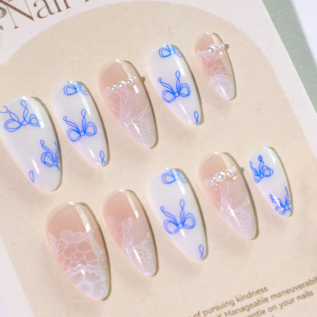 Artistic stiletto nails with delicate bow decorations Bowlift