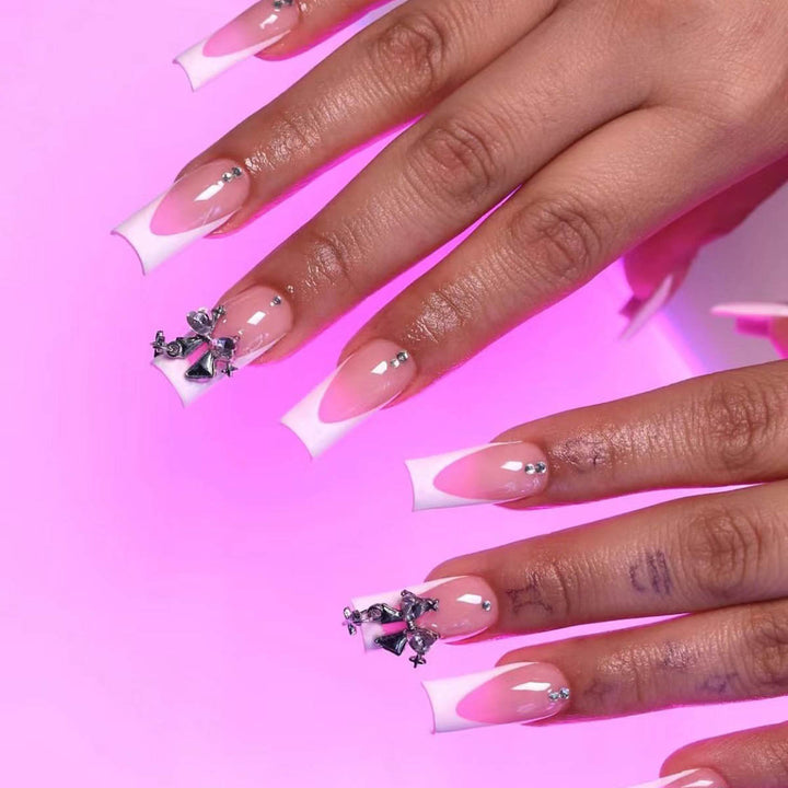 Artificial nail set with luxurious French tips and elegant embellishments Bowlift