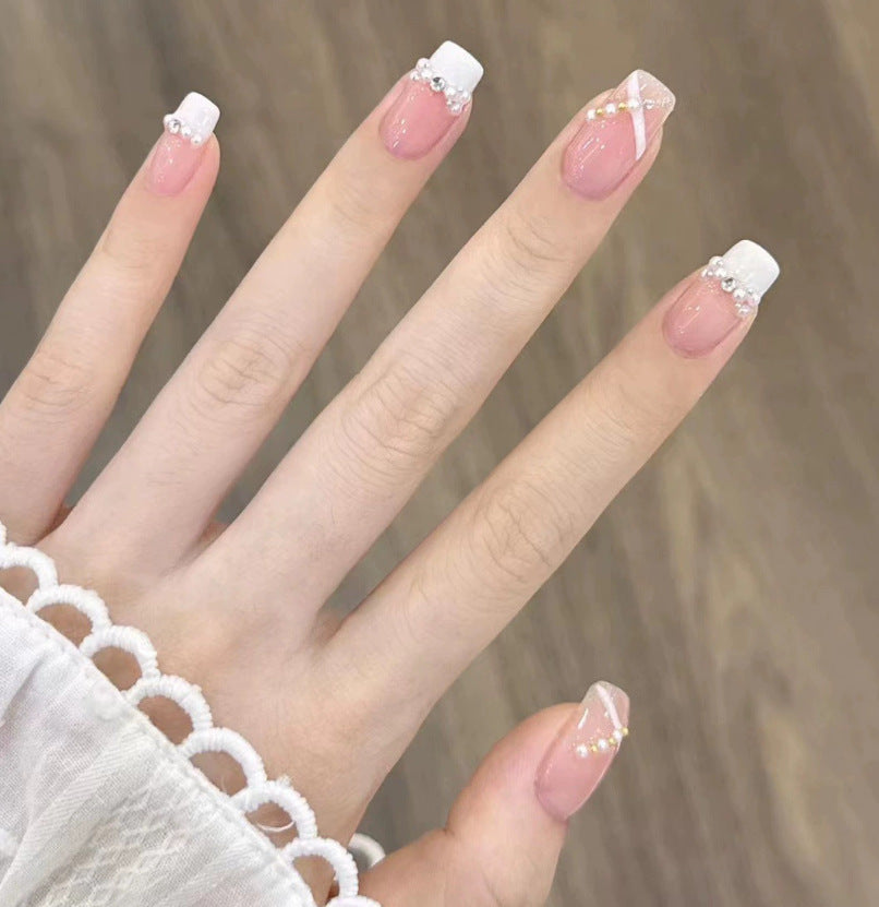 Elegant nail design with pearl embellishment Bowlift
