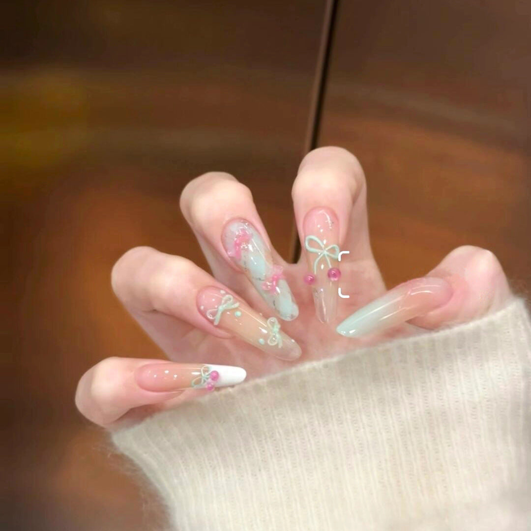 Artistic Press-On Nail Extensions with Floral Embellishments Bowlift