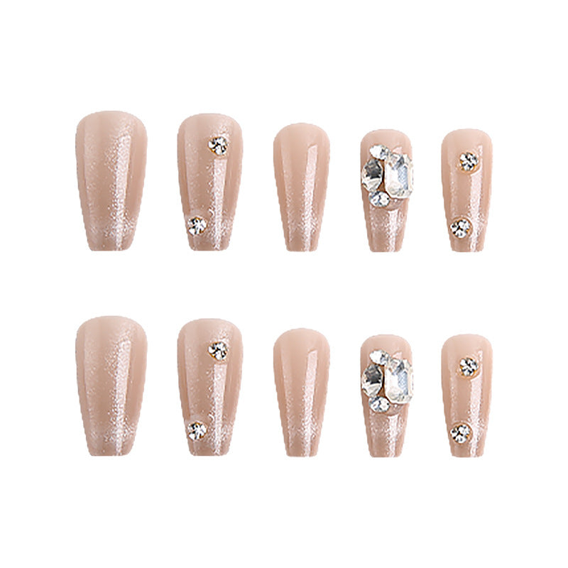 Acrylic nail set with glamorous glitter accents and elegant jewelry embellishments Bowlift