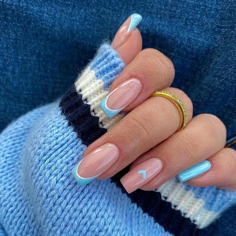 Artful nail art with pastel blue accents Bowlift