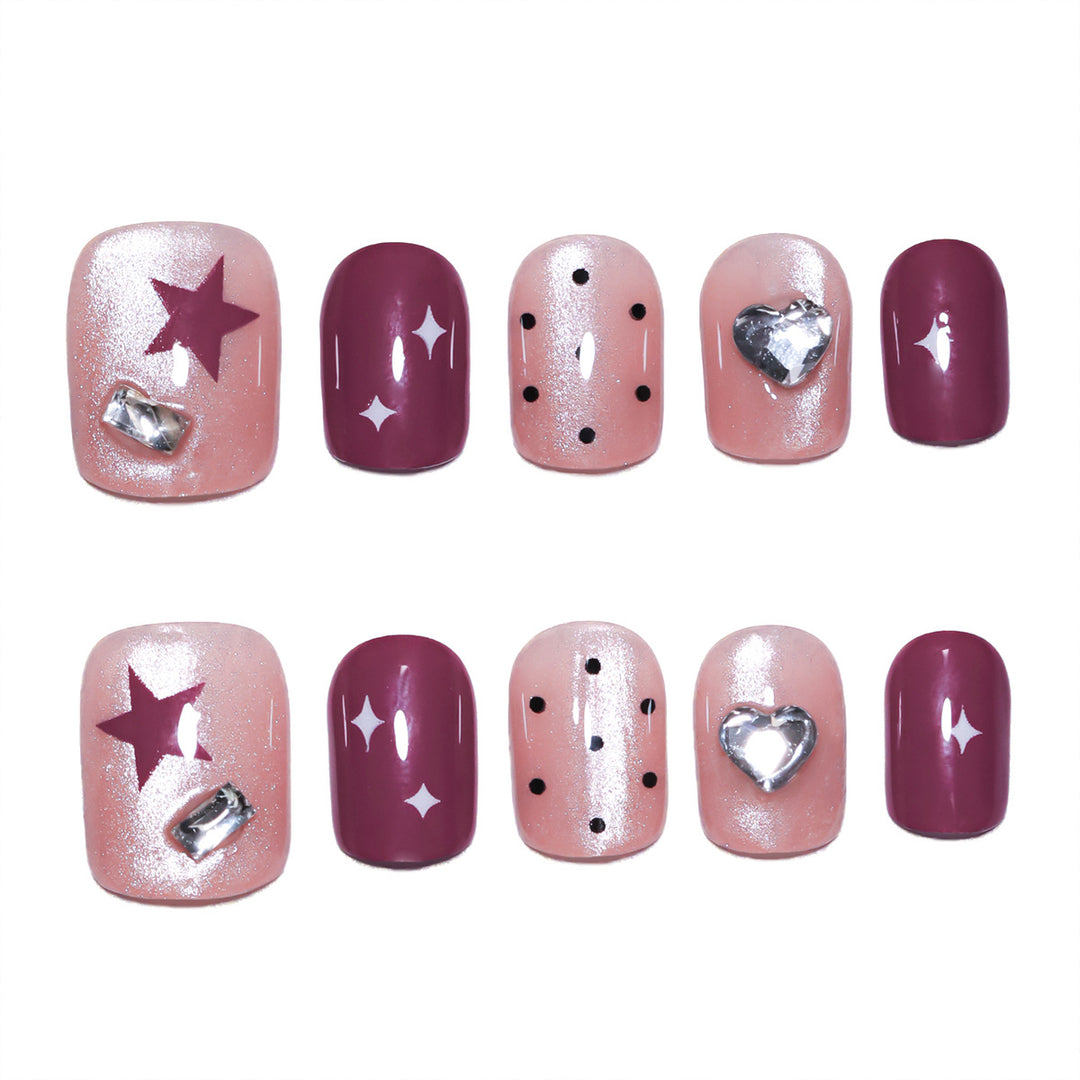 Artificial nail extensions with unique jewelry accents Bowlift