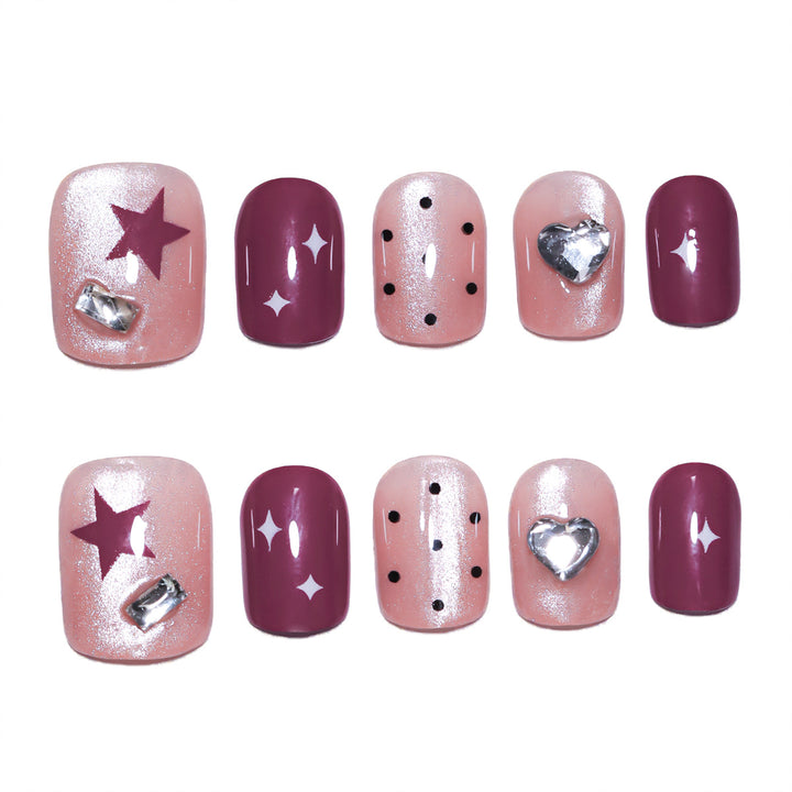 Artificial nail extensions with unique jewelry accents Bowlift