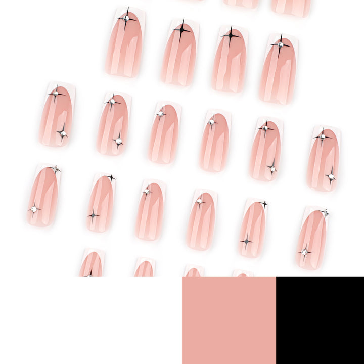 Artificial nail extensions with elegant French tip and glitter accents Bowlift