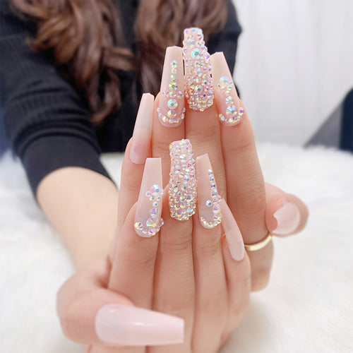 Glamorous nail extensions with rhinestone accents Bowlift