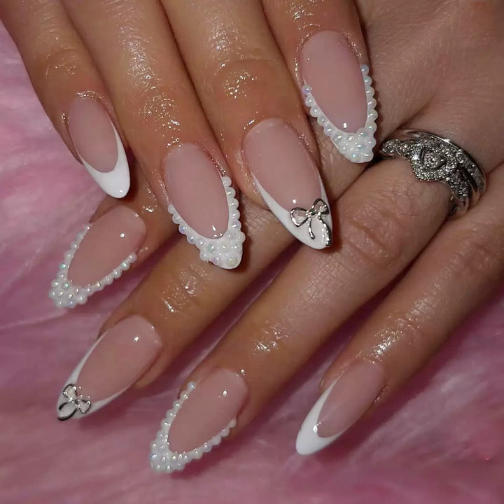 Acrylic nail set with elegant pearl and bow decorations Bowlift