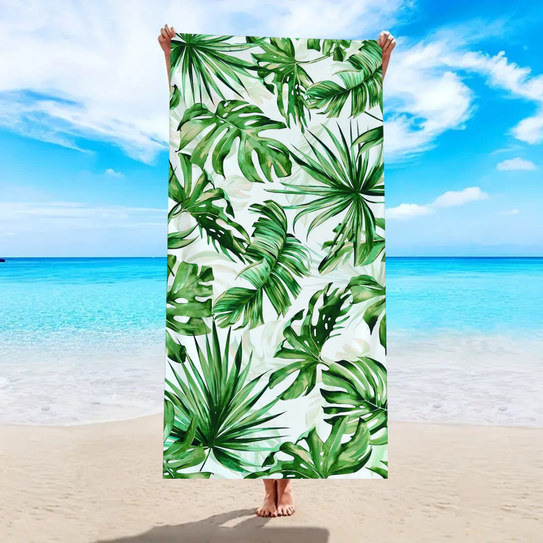 Beach towel with tropical palm leaf pattern Bowlift