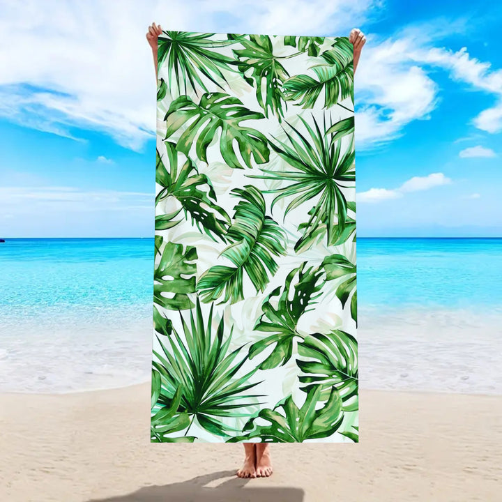 Beach towel with tropical palm leaf pattern Bowlift