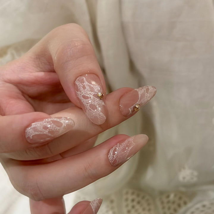 Elegant artificial nails with tips and glitter Bowlift