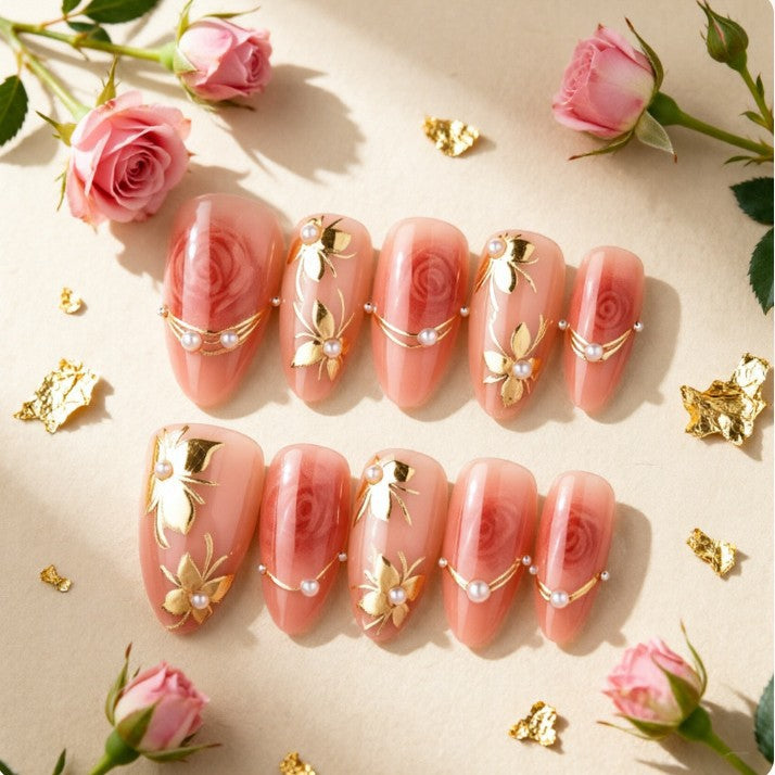 Artistic Nail Tips with Elegant Gold Jewelry Bowlift
