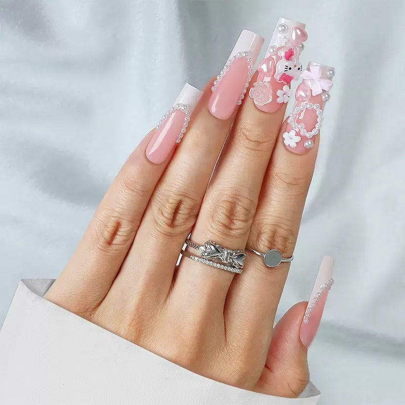 Acrylic nail set with playful 3D accents and pearl details Bowlift