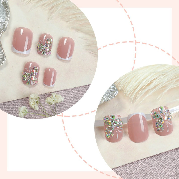 Artifical nail set with sparkling accents and elegant bows Bowlift