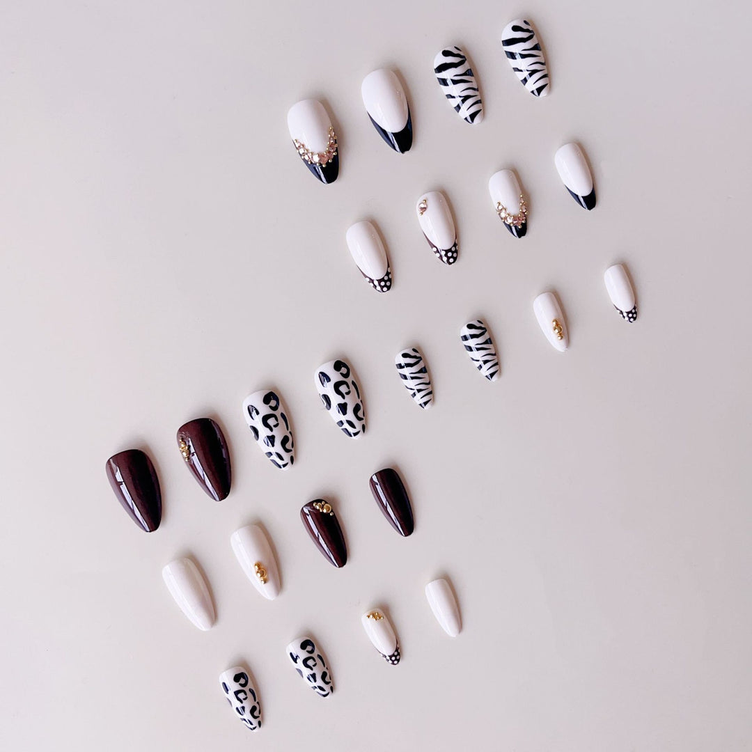 Acrylic nail set with luxurious animal motif designs and glamorous accents Bowlift