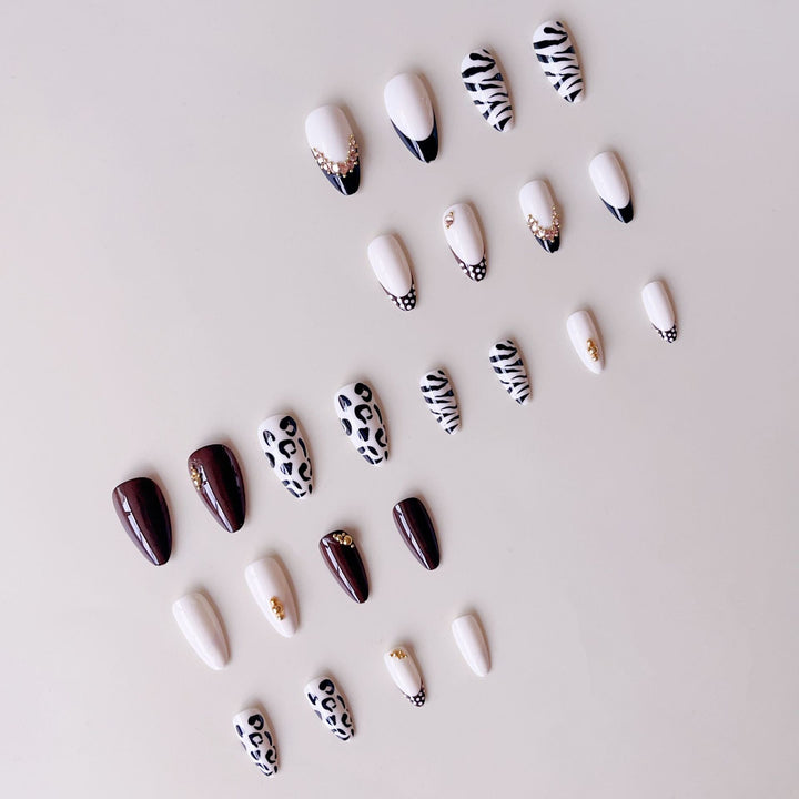 Acrylic nail set with luxurious animal motif designs and glamorous accents Bowlift