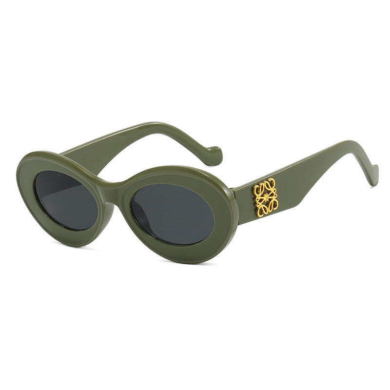 Women's fashionable sunglasses with oval frame and golden accents Bowlift