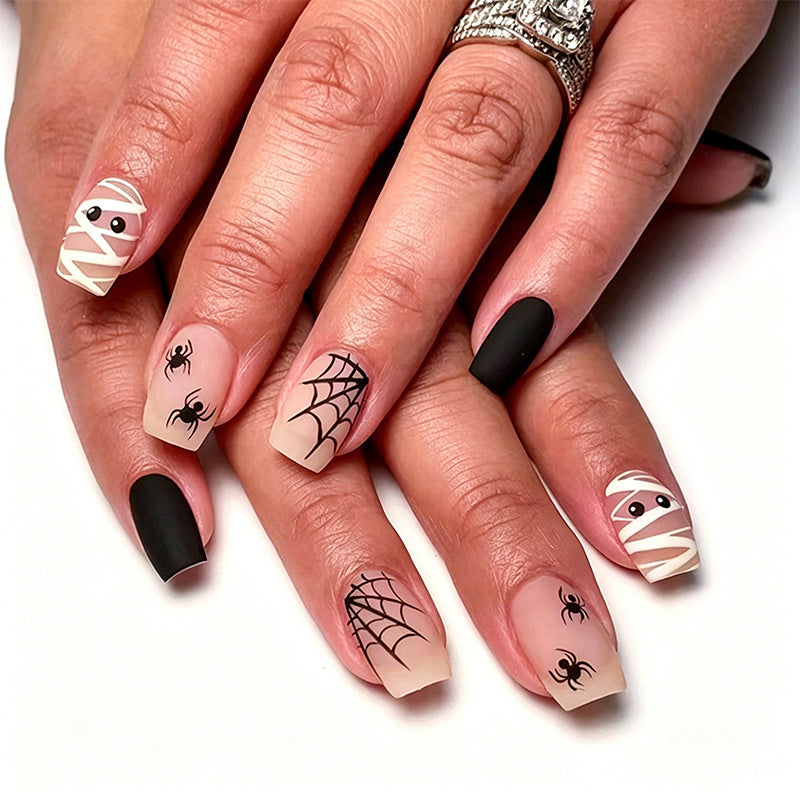 Artificial nail set with creepy Halloween motif and delicate spider designs Bowlift