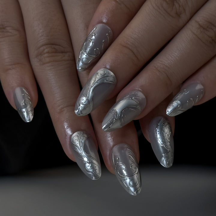 Artistic stiletto nails with elegant silver design Bowlift