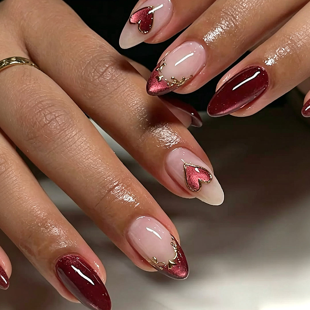 Artful stiletto nails with heart designs and glitter embellishment Bowlift
