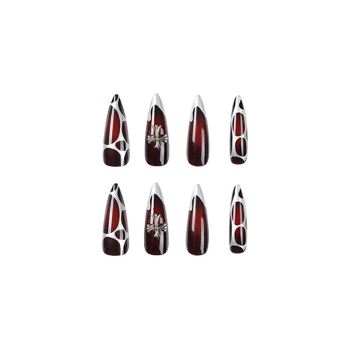 Artful Stiletto Nails with Elegant Cross Decoration Bowlift