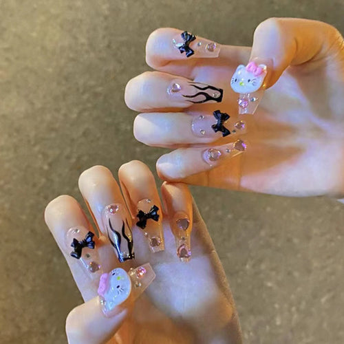 Artful nail extensions with Hello Kitty and floral accents Bowlift