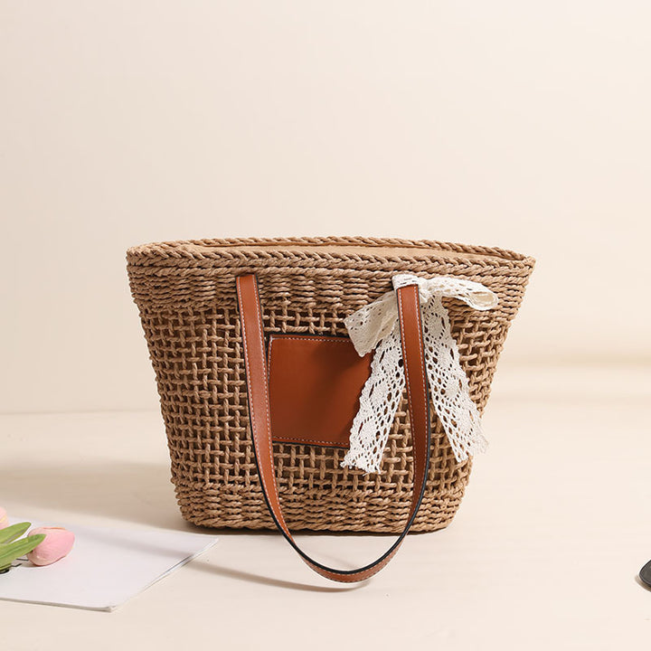 Handmade straw bag with elegant leather accents Bowlift
