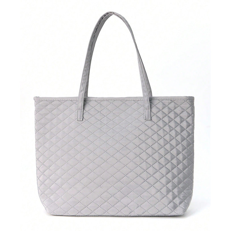 Fashionable handbag made of textured material Bowlift