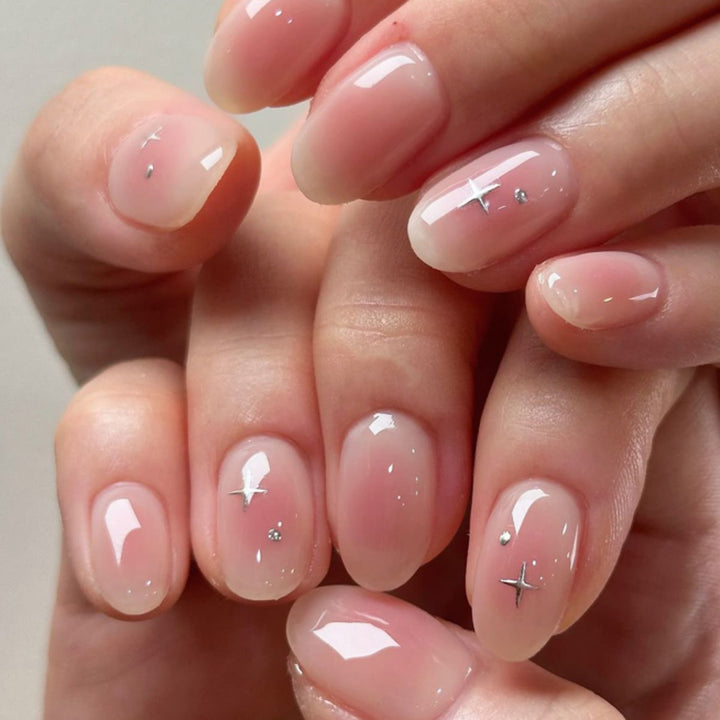 Artful nail extensions with shiny rhinestone accents Bowlift