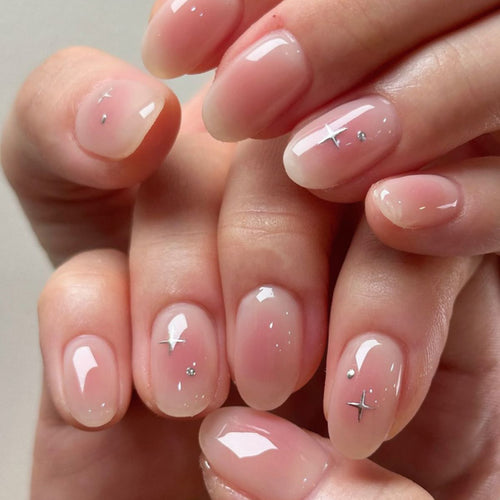 Artful nail extensions with shiny rhinestone accents Bowlift