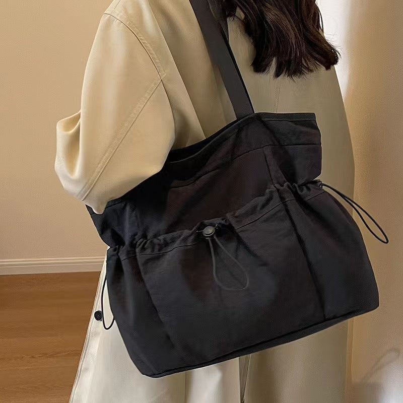 Practical everyday handbag with drawstring Bowlift