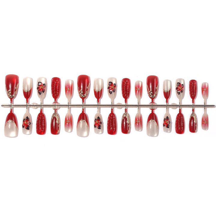 Artificial nail set with elegant floral details and glitter accents Bowlift